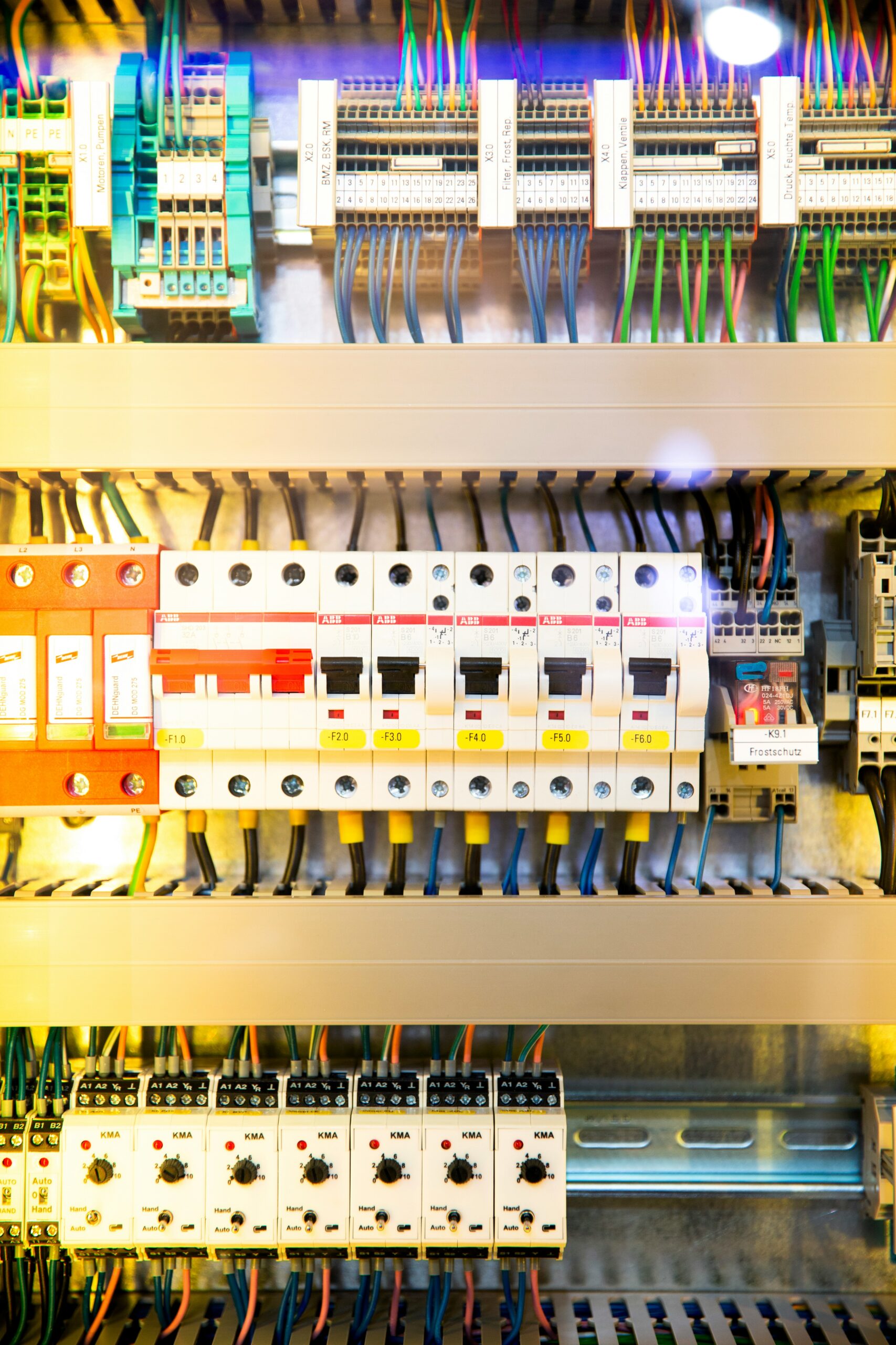 An electric main circuit board showing breakers.